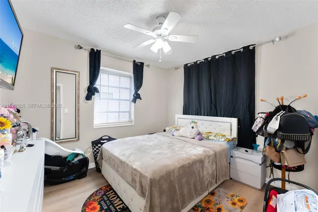 a bedroom that has a bed and a chair in it