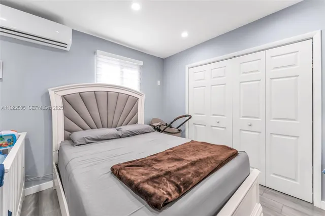 a kitchen with stainless steel appliances granite countertop a refrigerator sink stove microwave and cabinets