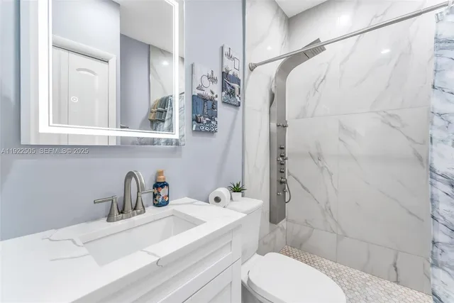 a view of a backyard with plants and a patio