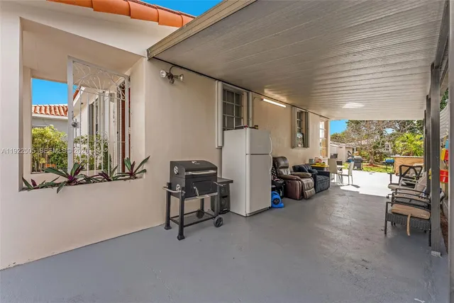 a view of a livingroom with furniture and a window