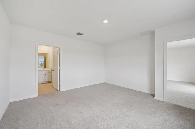 an empty room with closet area