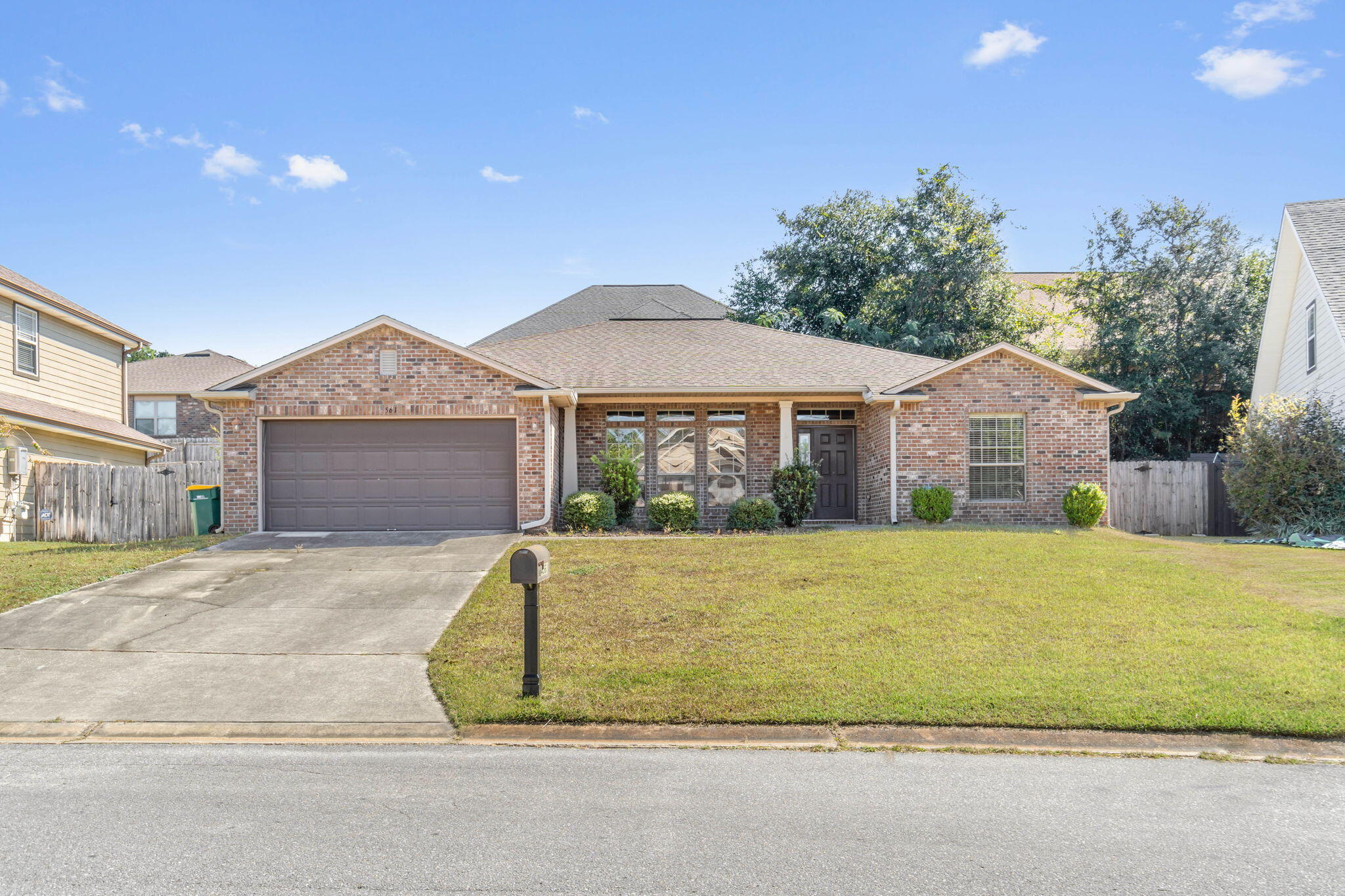 4561 Hermosa Road Crestview, FL 32539 - Photo 1 of 27 a front view of a house with a garden and entryway