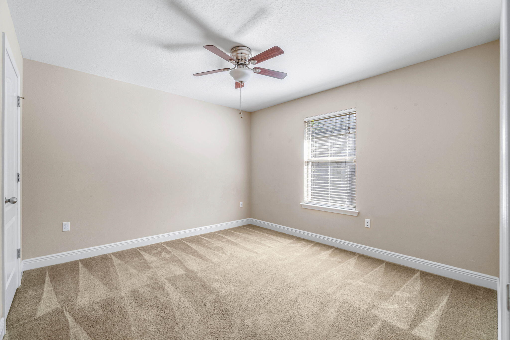 4561 Hermosa Road Crestview, FL 32539 - Photo 21 of 27 a view of an empty room with a window