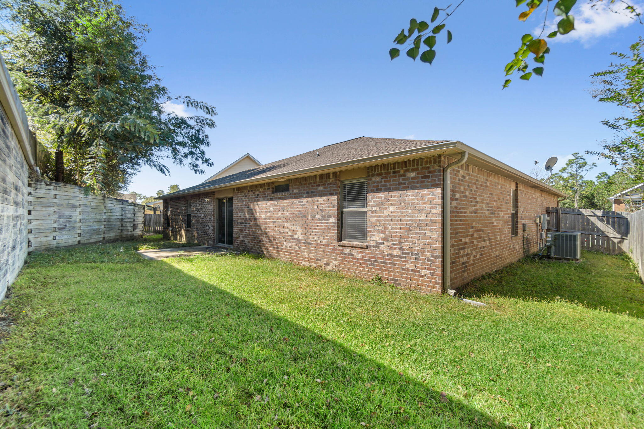 4561 Hermosa Road Crestview, FL 32539 - Photo 25 of 27 a front view of house with yard and green space