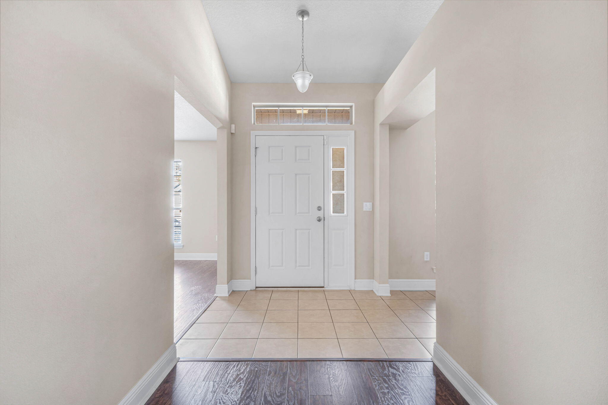 4561 Hermosa Road Crestview, FL 32539 - Photo 4 of 27 a view of a hallway with a chandelier
