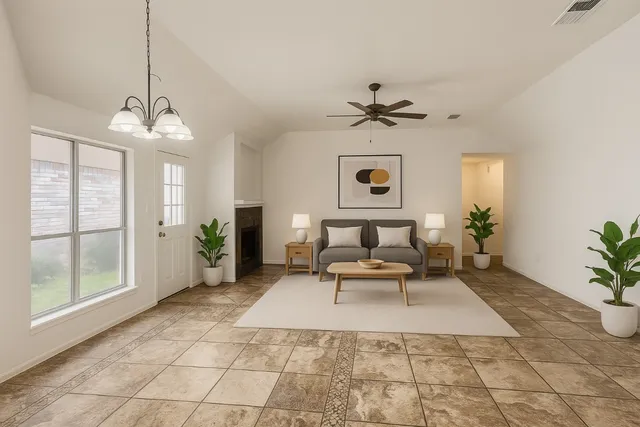 a living room with furniture and a chandelier