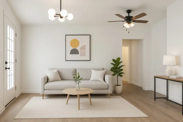 a living room with furniture a chandelier and a window