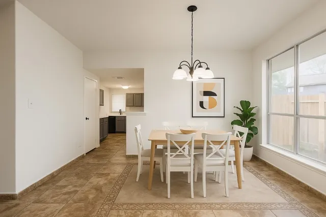 a dining room with furniture window and wooden floor