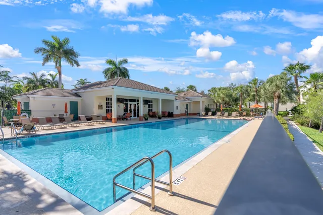 an aerial view of a house with a lake view