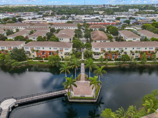an aerial view of a city with lake view