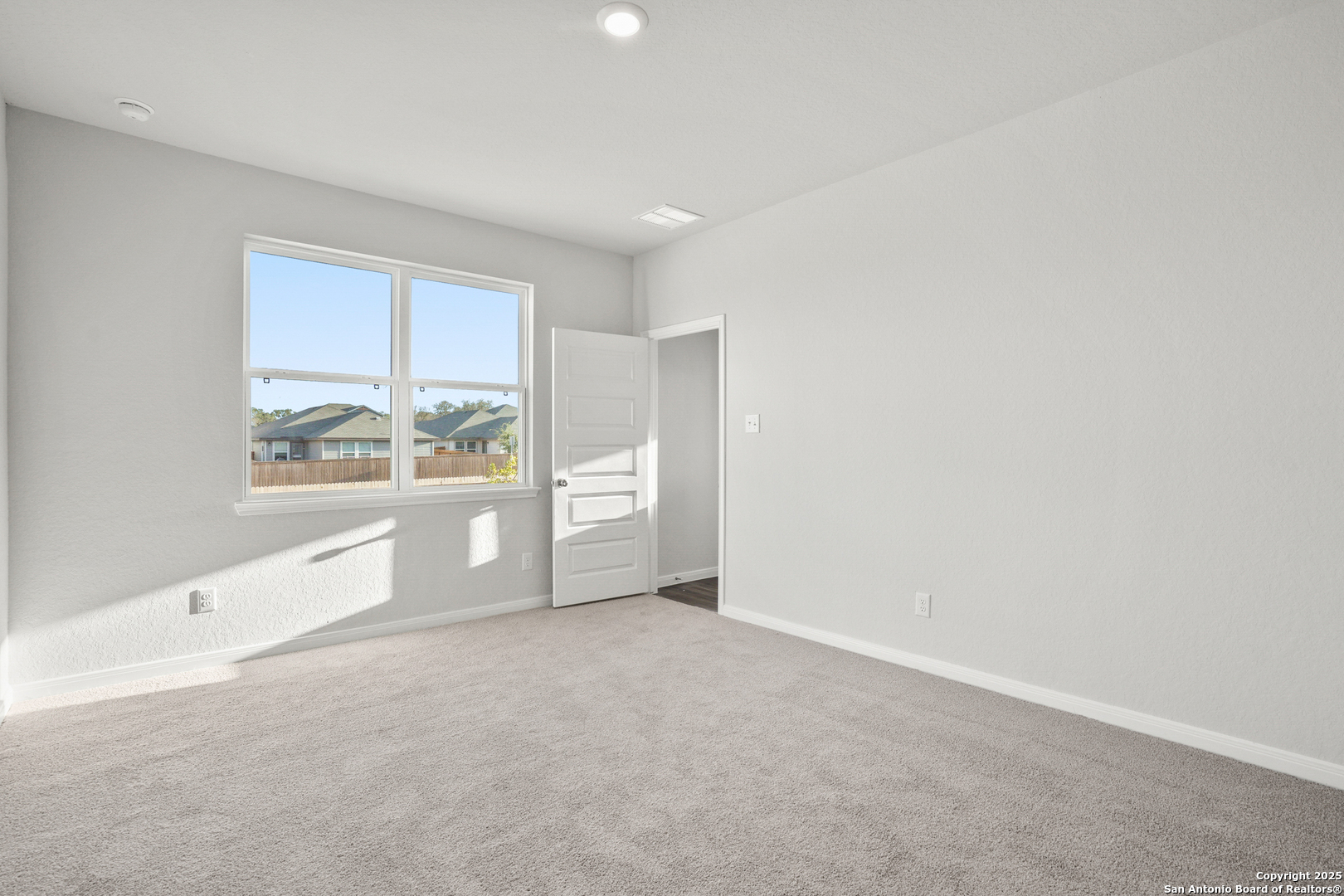13636 Helton Pass St. Hedwig, TX 78152 - Photo 11 of 34 a view of an empty room with a window