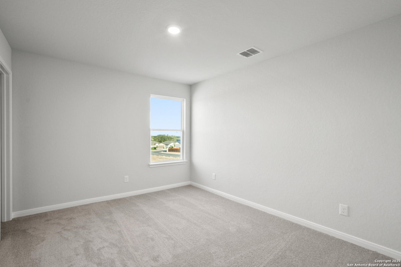 13636 Helton Pass St. Hedwig, TX 78152 - Photo 21 of 34 a view of an empty room and window