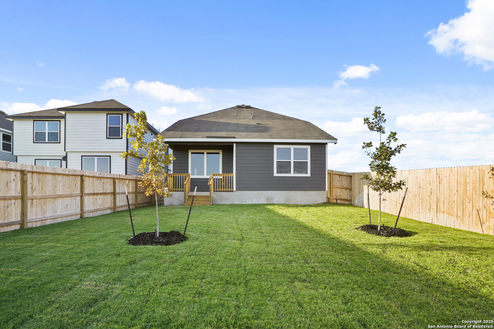 13636 Helton Pass St. Hedwig, TX 78152 - Photo 25 of 34 a front view of a house with a garden