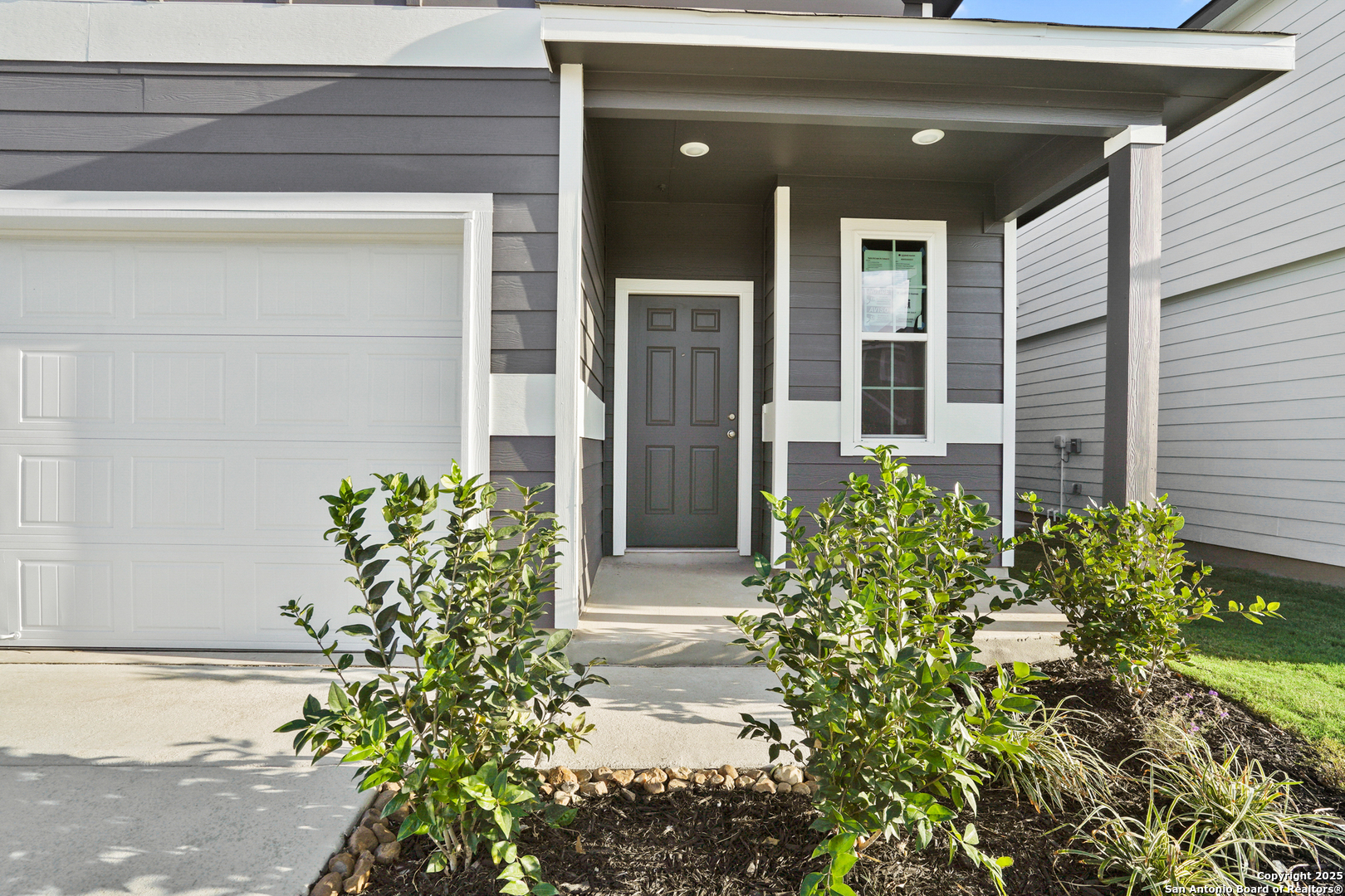 13636 Helton Pass St. Hedwig, TX 78152 - Photo 3 of 34 a couple of potted plants in front of door