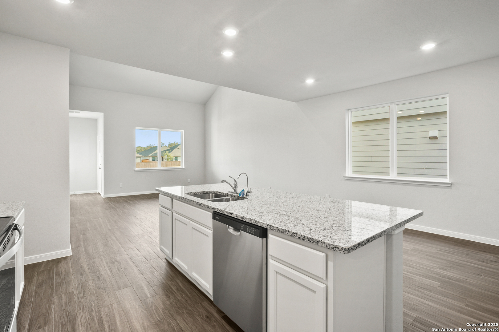 13636 Helton Pass St. Hedwig, TX 78152 - Photo 5 of 34 a kitchen with a sink stove and cabinets