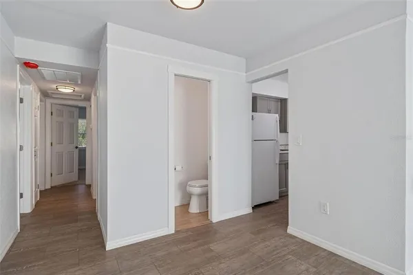 a view of a bathroom with a toilet & a sink