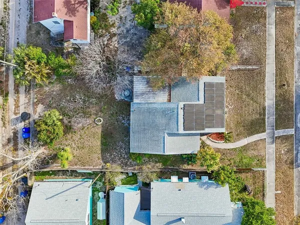 an aerial view of residential houses with outdoor space