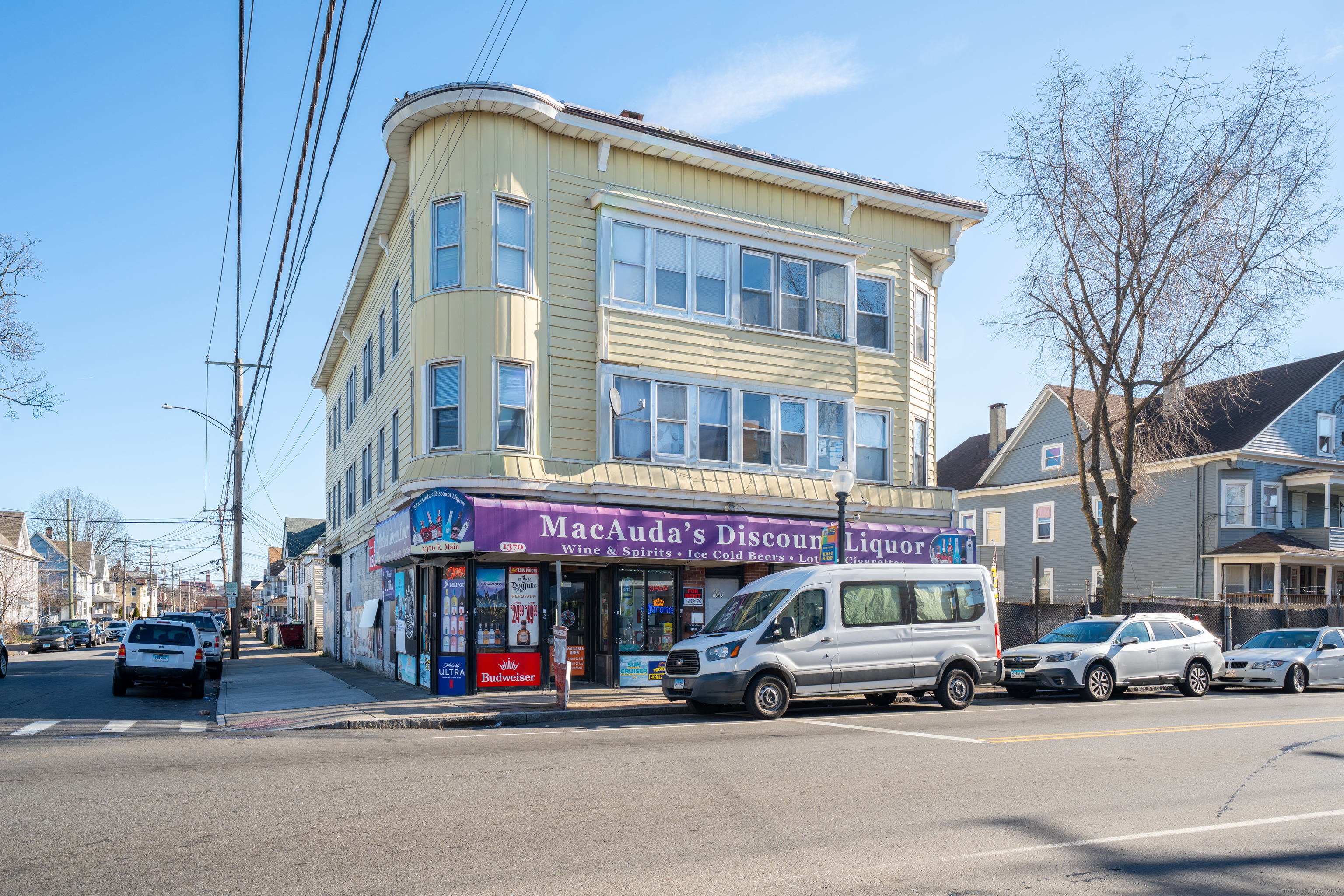 1368 East Main Street, Unit 4 Bridgeport, CT 06608 - Photo 1 of 14 a car parked in front of a building