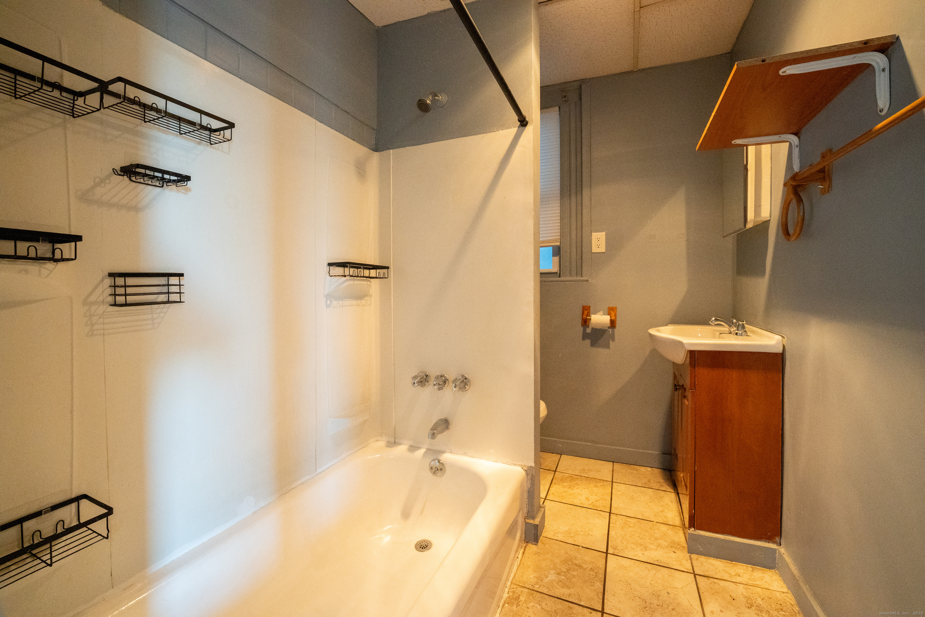 1368 East Main Street, Unit 4 Bridgeport, CT 06608 - Photo 13 of 14 a bathroom with a tub and shower