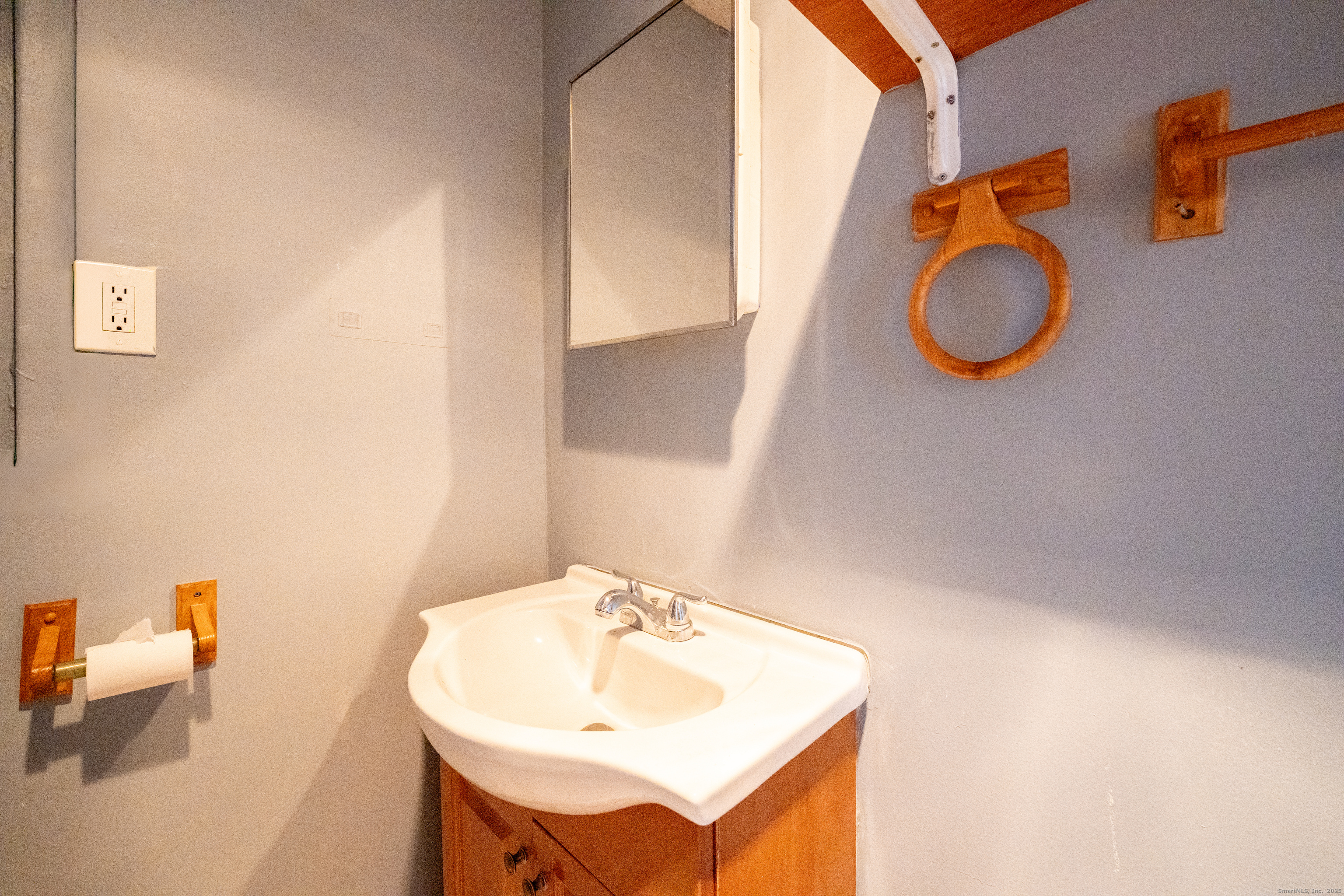 1368 East Main Street, Unit 4 Bridgeport, CT 06608 - Photo 14 of 14 a bathroom with a sink and a mirror