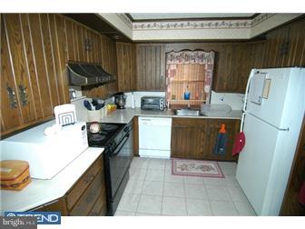 1024 Fern Avenue Reading, PA 19607 - Photo 8 of 12 a kitchen with stainless steel appliances granite countertop a sink stove and refrigerator