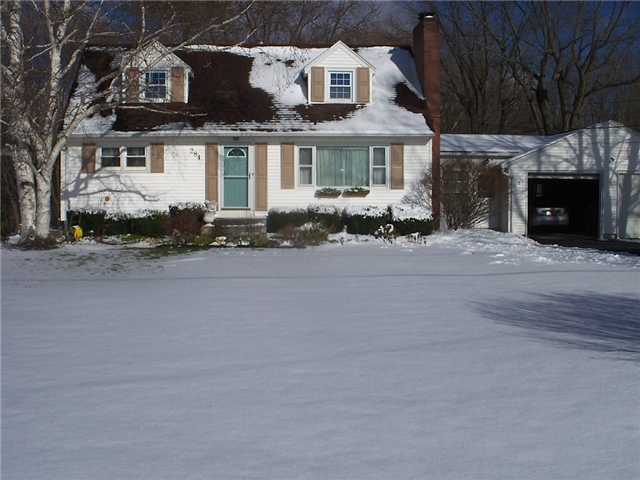 284 Burnt Mill Road Riga, NY 14428 - Photo 1 of 1 Exterior Front Lovely Cape Cod on large wooded lot