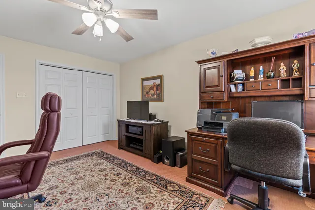 a workspace with furniture and window