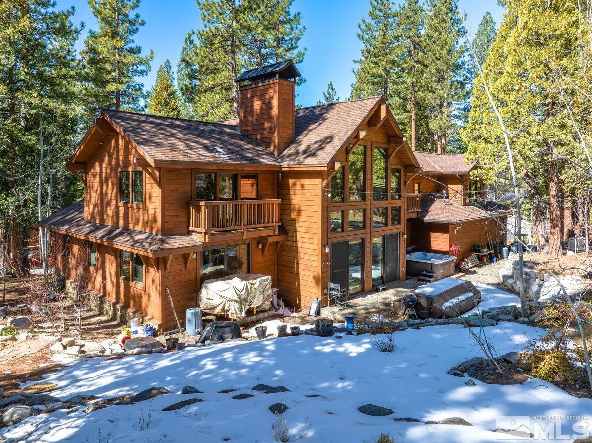 2147 The Back Road Glenbrook, NV 89413 - Photo 26 of 40 a view of a house with street chairs and a fire pit