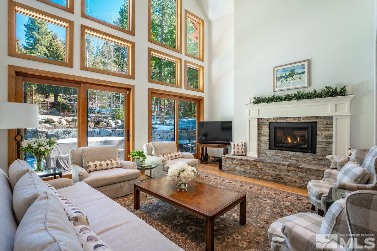 2147 The Back Road Glenbrook, NV 89413 - Photo 3 of 40 a living room with furniture a fireplace and windows