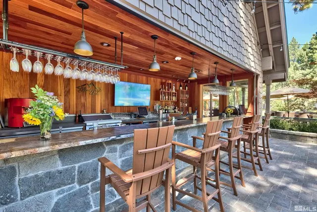 a group of chairs sitting in patio of a building