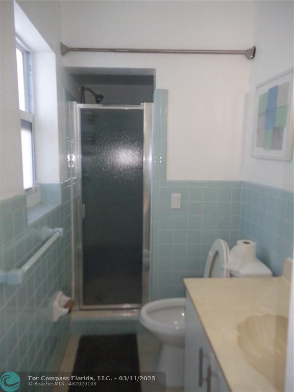 999 South Riverside Drive, Unit 202 Pompano Beach, FL 33062 - Photo 9 of 9 a bathroom with a sink and a mirror