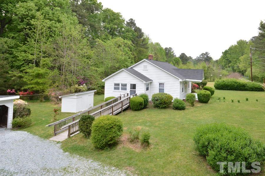 1703 Umstead Road Durham, NC 27712 - Photo 2 of 23 a front view of a house with garden