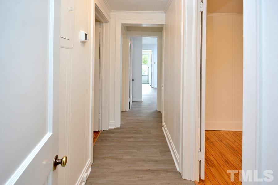 1703 Umstead Road Durham, NC 27712 - Photo 11 of 23 a view of a hallway with wooden floor and staircase