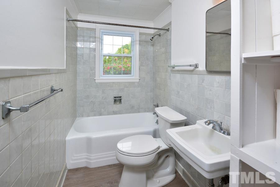 1703 Umstead Road Durham, NC 27712 - Photo 13 of 23 a bathroom with a sink toilet and shower