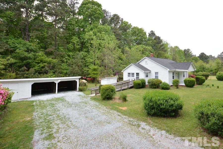 1703 Umstead Road Durham, NC 27712 - Photo 16 of 23 a front view of a house with garden