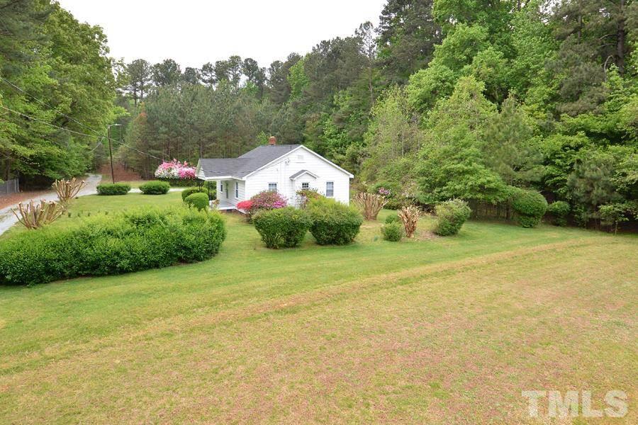 1703 Umstead Road Durham, NC 27712 - Photo 3 of 23 a view of a backyard