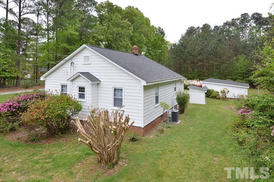 1703 Umstead Road Durham, NC 27712 - Photo 22 of 23 a view of a house with backyard and garden