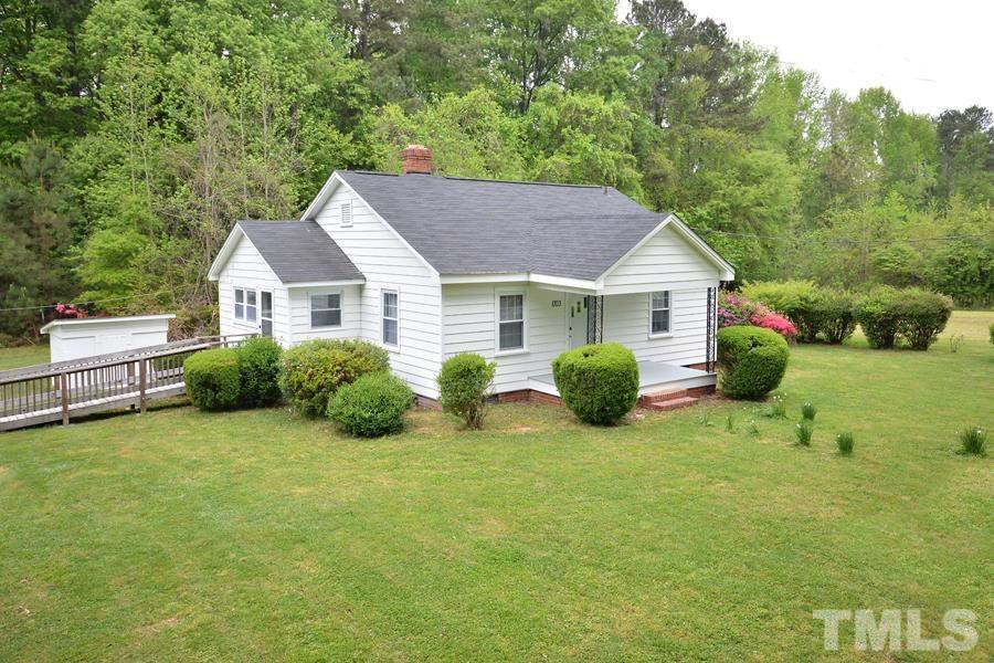 1703 Umstead Road Durham, NC 27712 - Photo 23 of 23 a view of a house with backyard and garden