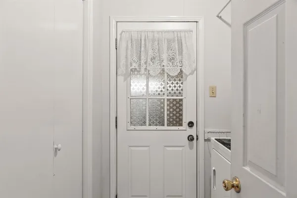 a view of a bathroom with a glass door