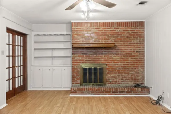 a view of fireplace and wooden floor