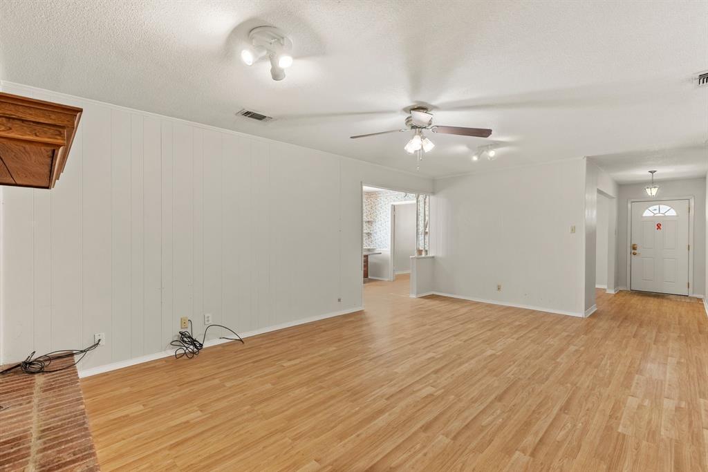 3013 Arapaho Road Commerce, TX 75428 - Photo 5 of 34 wooden floor in an empty room