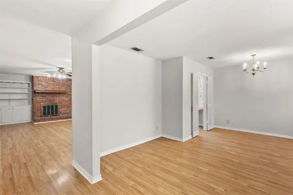 a view of a livingroom with wooden floor