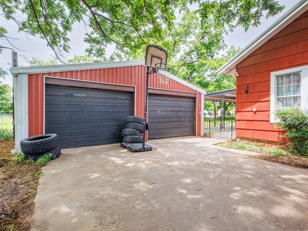 510 South Main Street Rising Star, TX 76471 - Photo 11 of 40 a view of a house with a yard and garage