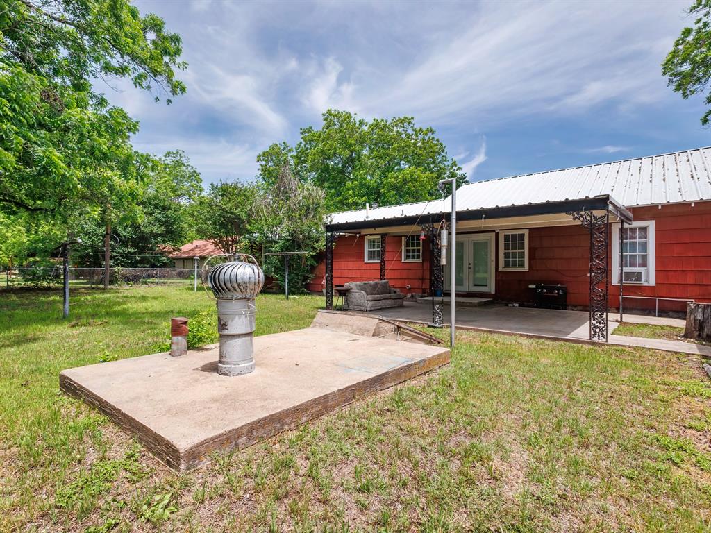 510 South Main Street Rising Star, TX 76471 - Photo 14 of 40 a view of a house with a yard porch and sitting area