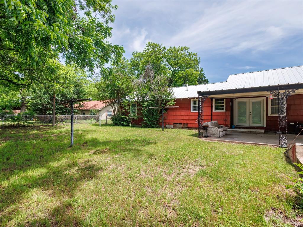 510 South Main Street Rising Star, TX 76471 - Photo 15 of 40 a view of a house with a backyard
