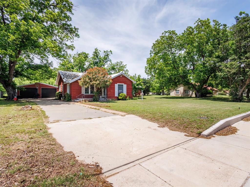 510 South Main Street Rising Star, TX 76471 - Photo 2 of 40 a front view of a house with a yard