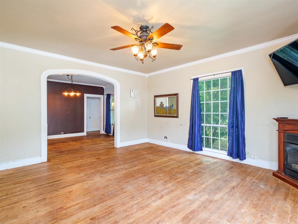 510 South Main Street Rising Star, TX 76471 - Photo 25 of 40 a view of an empty room with a window and a kitchen