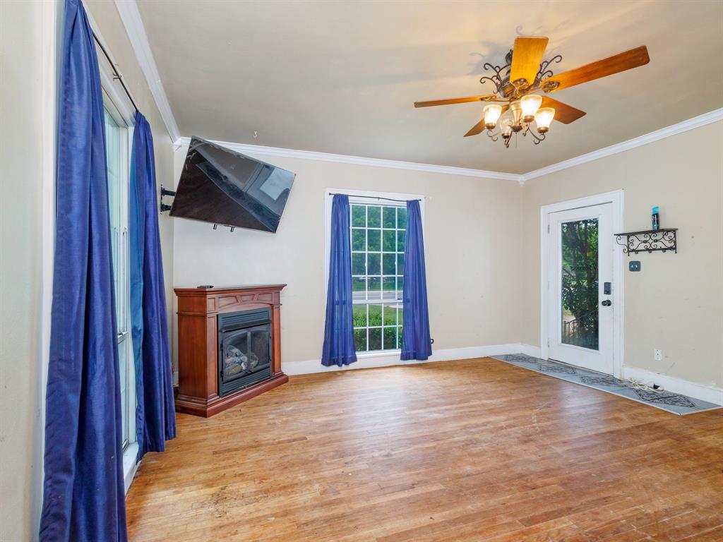 510 South Main Street Rising Star, TX 76471 - Photo 26 of 40 a view of an empty room with window and fire place