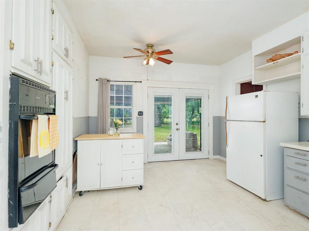 510 South Main Street Rising Star, TX 76471 - Photo 28 of 40 a view of kitchen with furniture and refrigerator