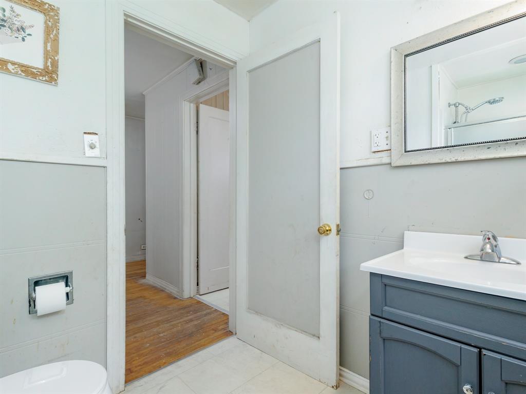 510 South Main Street Rising Star, TX 76471 - Photo 39 of 40 a bathroom with a sink and mirror